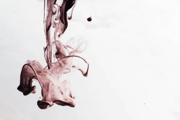 An abstract dark red splash against a white and grey background