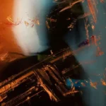 An inexplicable abstract image in various browns, oranges, and whites.