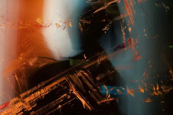 An inexplicable abstract image in various browns, oranges, and whites.