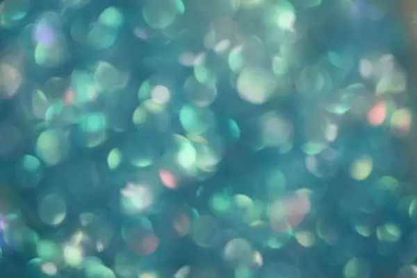 An abstract image of light refractions in various hues of blue