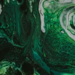 Abstract swirls of green liquid