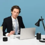 A corporate manager person sat at a desk