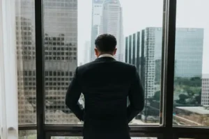 A corporate geezer looking out his office window