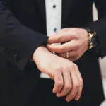 An amployer fiddling with his suit cuff