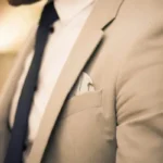 The torso of a man wearing a suit