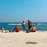 A group of older people sunbathing at the beach