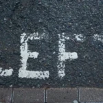 A road marking which says the word left