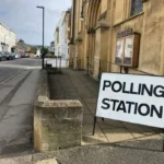 A road sign saying 'polling station'.