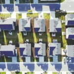 A blue and white suburban housing complex