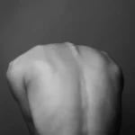 Black and white image of a persons back