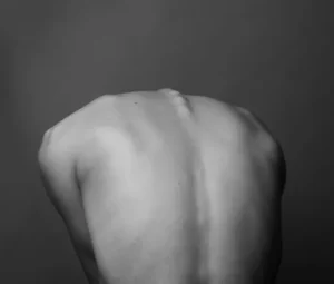 Black and white image of a persons back