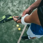 Somebody holding a tennis racket