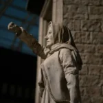 A statue of a woman with her fist in the air